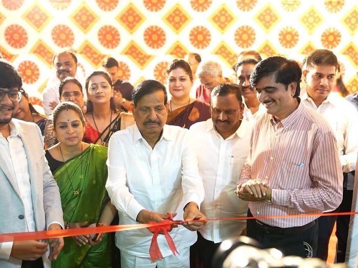 The ribbon being cut at the clinic entrance during the opening ceremony, with Dr. Adarsh Patil and invited guests standing on either side